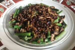 A healthier version of French's green bean casserole with slow cooked caramelized onions and a creamy mushroom sauce that tastes great!