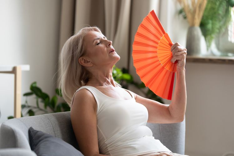 Menopausal woman having a hot flash